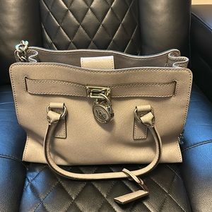 Michael Kors top closure with silver hardware
